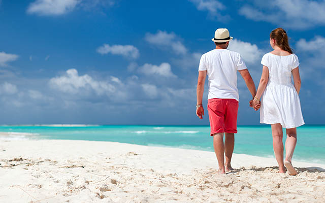 Couple walking along the beach